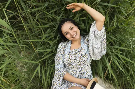 top view woman laying grass